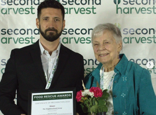 Board member Marguerite Rea receives award on behalf of the Corner Drop-in from Paul Parillo, Ontario Operations Coordinator for Second Harvest