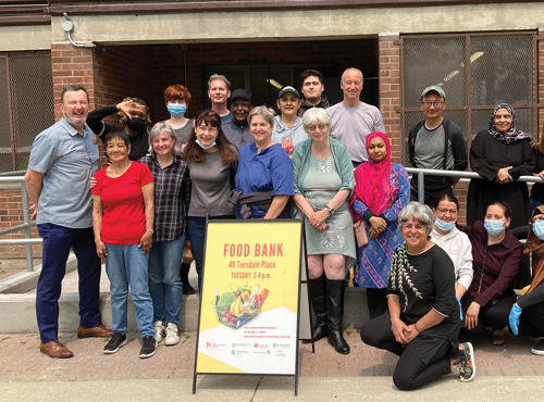 staff and volunteers stand in front of the Teesdale Food Bank