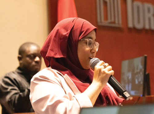 Young person speaking out at the podium during the Youth Employment Summit