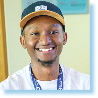 smiling young man in a baseball cap