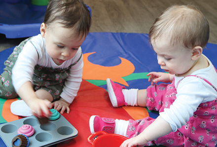 toddlers playing inside the Harbourfront Child Care Centre