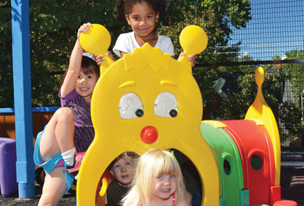 Children playing in the Ontario Street Child Care Centre playground