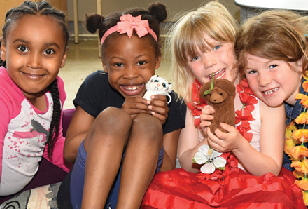 four girls with stuffed animals at the Winchester Child Care Centre