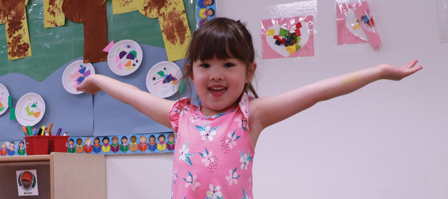 girl spreading arms in the Yonge and Sheppard Childcare Centre