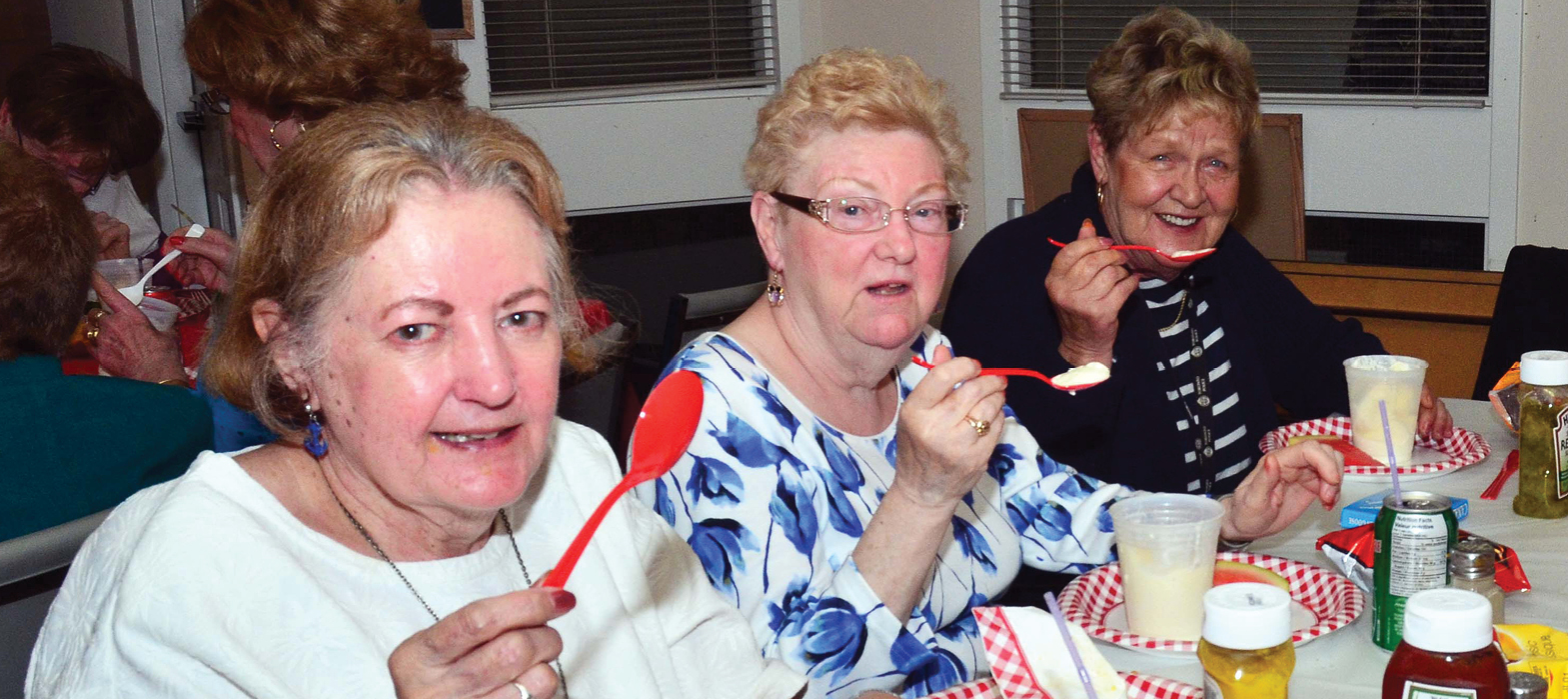 elderly women sharing a meal in the dining room at 11 Coatsworth