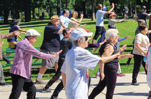 seniors doing Tai Chi in a park